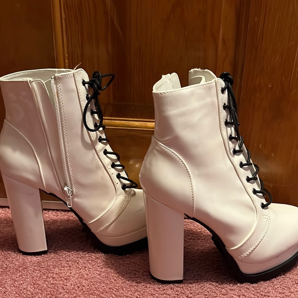 Fashion nova white heeled boots.